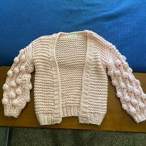 Cozy Pink knit cardigan with Pom Pom sleeves